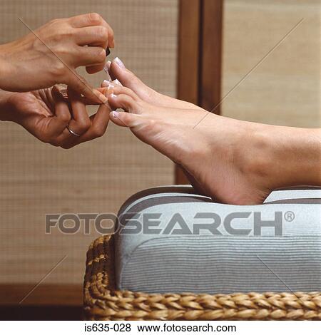 Woman having a pedicure View Large Photo Image Stock Photo - Woman having a pedicure. Fotosearch