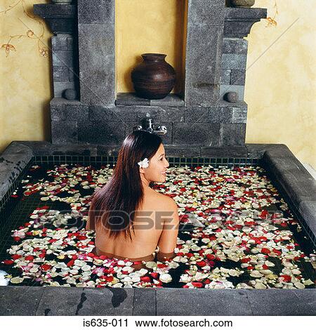 Woman in bath with petals View Large Photo Image Stock Image - Woman in bath with petals. Fotosearch