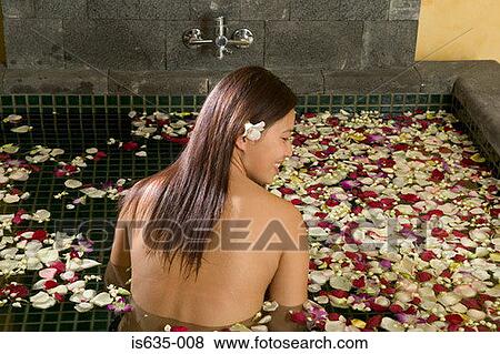 Woman in bath with petals View Large Photo Image Stock Photo - Woman in bath with petals. Fotosearch