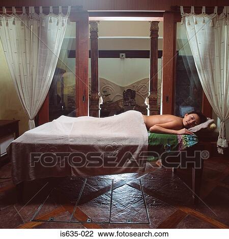 Stock Image - Woman sleeping on massage table. Fotosearch