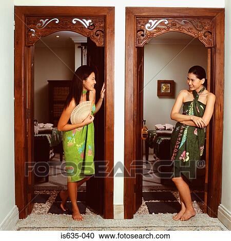 Women talking in doorway View Large Photo Image Stock Image - Women talking in doorway. Fotosearch