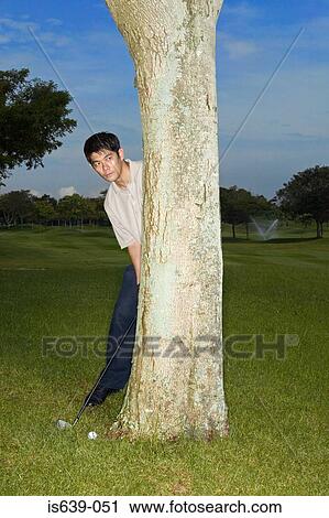 Asian man playing golf View Large Photo Image Stock Image - Asian man playing golf. Fotosearch