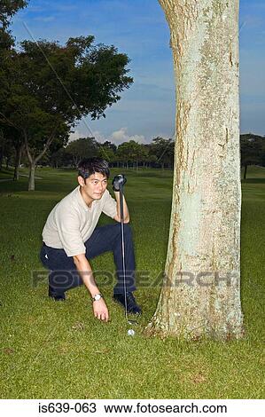 Asian man playing golf View Large Photo Image Stock Image - Asian man playing golf. Fotosearch