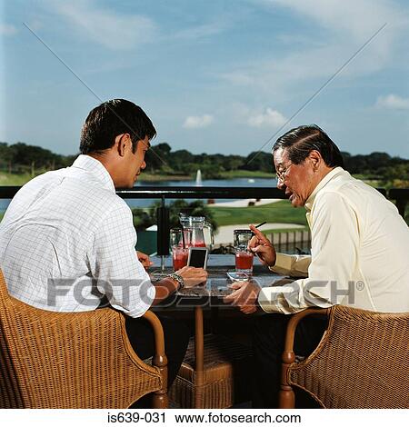 Stock Image - Father and son talking. Fotosearch