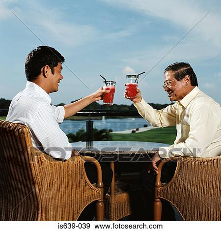 Father and son toasting View Large Photo Image Stock Photo - Father and son toasting. Fotosearch