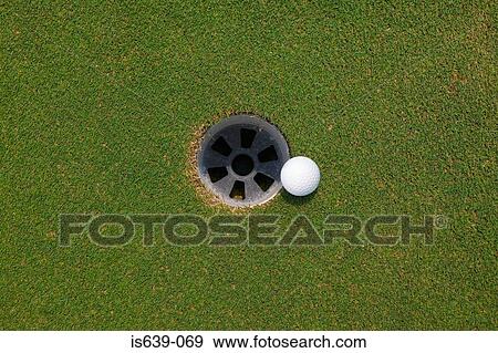 Golf ball and hole View Large Photo Image Stock Photo - Golf ball and hole. Fotosearch