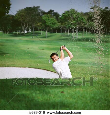 Golfer in sand trap View Large Photo Image Stock Photograph - Golfer in sand trap. Fotosearch