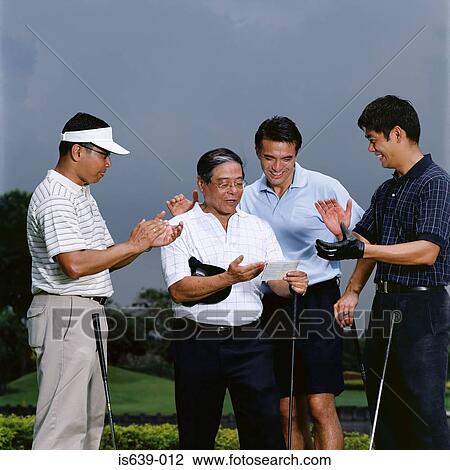 Stock Image - Golfers celebrating. Fotosearch
