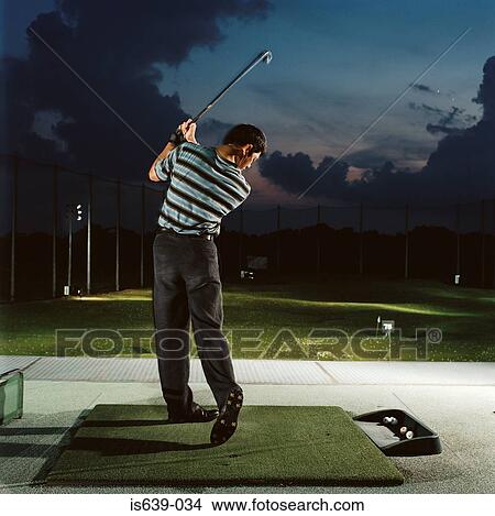 Man practising on driving range View Large Photo Image Picture - Man practising on driving range. Fotosearch