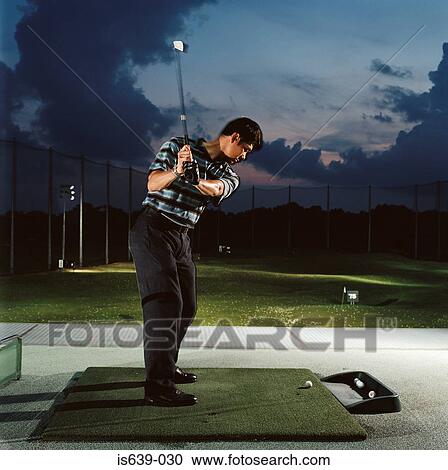 Man practising on driving range View Large Photo Image Stock Image - Man practising on driving range. Fotosearch