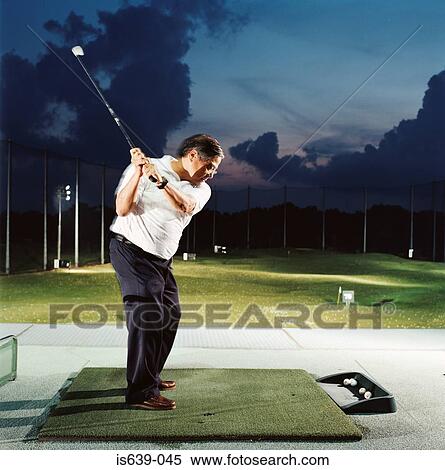 Man practising on driving range View Large Photo Image Stock Photography - Man practising on driving range. Fotosearch