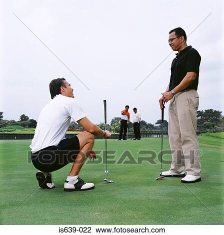 Men playing golf View Large Photo Image Stock Image - Men playing golf. Fotosearch