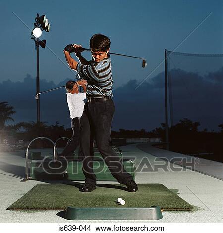 Men practising on driving range View Large Photo Image Picture - Men practising on driving range. Fotosearch