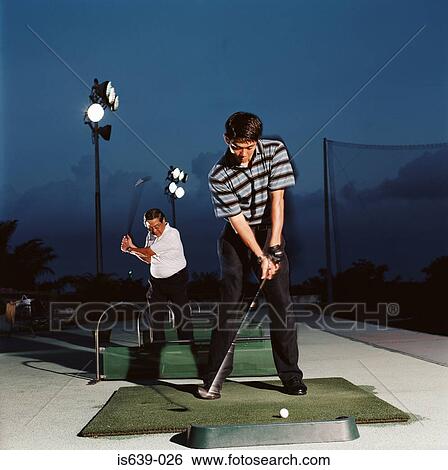 Men practising on driving range View Large Photo Image Stock Photograph - Men practising on driving range. Fotosearch