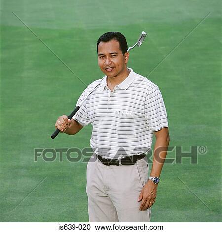 Stock Image - Portrait of a male golfer. Fotosearch