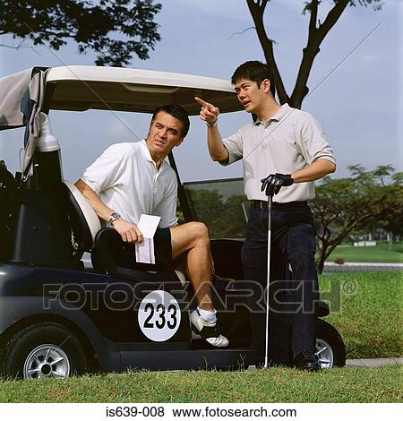 Stock Photo - Two men playing golf. Fotosearch