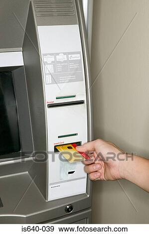 Man using a cash machine View Large Photo Image Stock Photo - Man using a cash machine. Fotosearch
