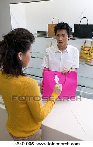 Woman buying handbag View Large Photo Image Stock Photography - Woman buying handbag. Fotosearch
