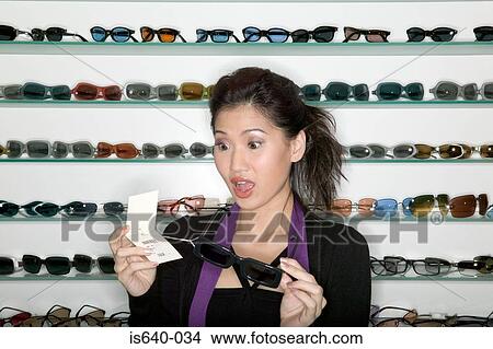 Woman shopping for sunglasses View Large Photo Image Picture - Woman shopping for sunglasses. Fotosearch