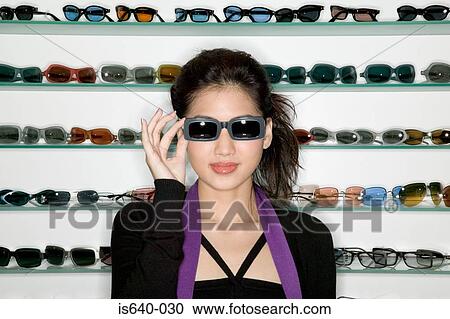 Woman shopping for sunglasses View Large Photo Image Stock Image - Woman shopping for sunglasses. Fotosearch