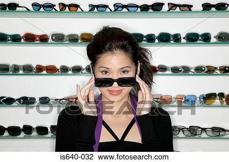 Woman shopping for sunglasses View Large Photo Image Stock Image - Woman shopping for sunglasses. Fotosearch