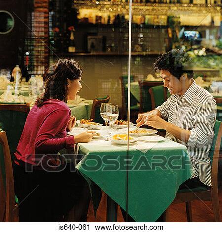 Young couple in restaurant View Large Photo Image Stock Image - Young couple in restaurant. Fotosearch