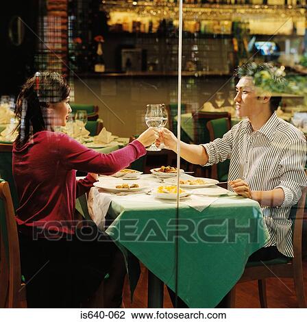 Young couple in restaurant View Large Photo Image Stock Image - Young couple in restaurant. Fotosearch