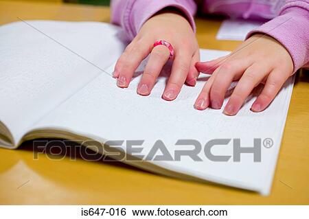 Blind girl reading braille View Large Photo Image Stock Photograph - Blind girl reading braille. Fotosearch