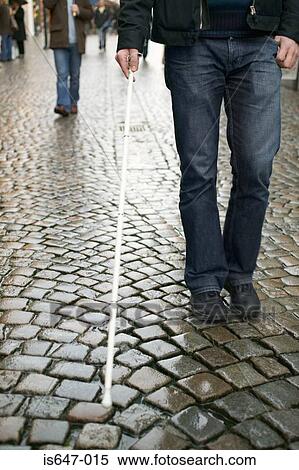 Blind man using a cane View Large Photo Image Stock Photography - Blind man using a cane. Fotosearch