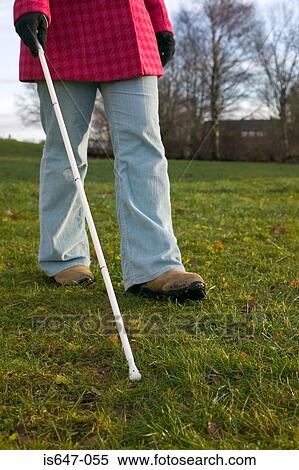 Blind woman using a cane View Large Photo Image Stock Photography - Blind woman using a cane. Fotosearch