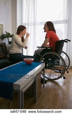 Disabled man and partner in apartment View Large Photo Image Stock Photo - Disabled man and partner in apartment. Fotosearch