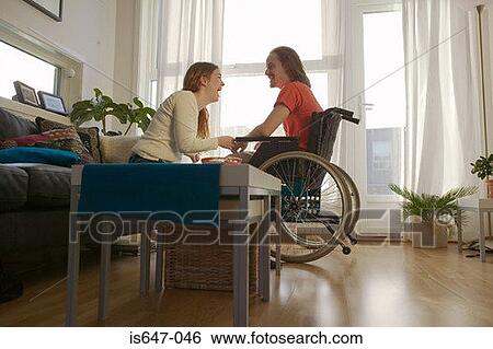 Disabled man and partner in apartment View Large Photo Image Stock Photograph - Disabled man and partner in apartment. Fotosearch
