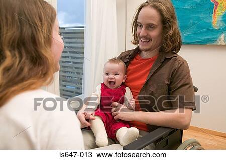 Disabled man with baby View Large Photo Image Stock Image - Disabled man with baby. Fotosearch
