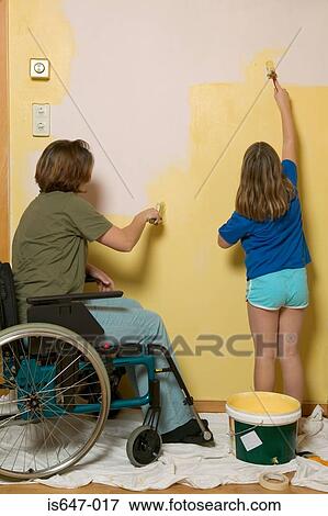 Disabled mother and daughter decorating View Large Photo Image Stock Photo - Disabled mother and daughter decorating. Fotosearch