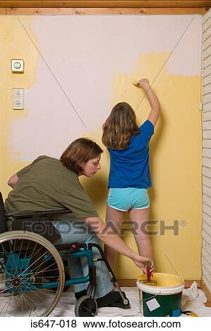 Disabled mother and daughter decorating View Large Photo Image Stock Photo - Disabled mother and daughter decorating. Fotosearch