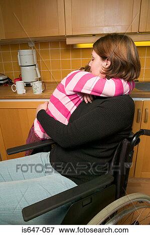 Disabled mother and daughter hugging View Large Photo Image Stock Photo - Disabled mother and daughter hugging. Fotosearch