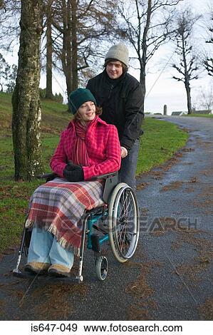 Disabled woman and partner in park View Large Photo Image Stock Photo - Disabled woman and partner in park. Fotosearch