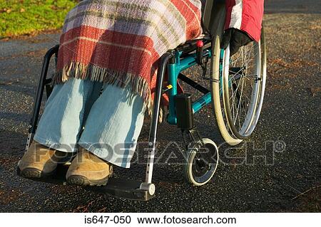 Stock Image - Disabled woman in wheelchair. Fotosearch