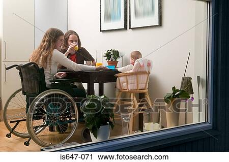 Family at dinner table View Large Photo Image Stock Image - Family at dinner table. Fotosearch
