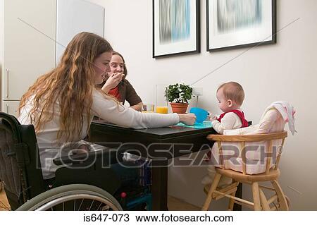 Family at dinner table View Large Photo Image Stock Image - Family at dinner table. Fotosearch