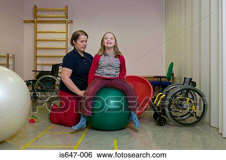 Girl exercising on fitness ball View Large Photo Image Stock Photograph - Girl exercising on fitness ball. Fotosearch
