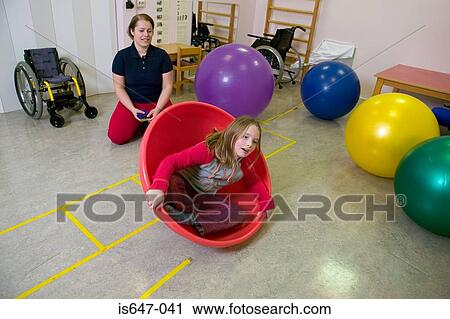 Stock Image - Girl playing in fitness ball. Fotosearch