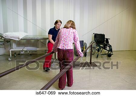 Girl walking using support bars View Large Photo Image Stock Photo - Girl walking using support bars. Fotosearch