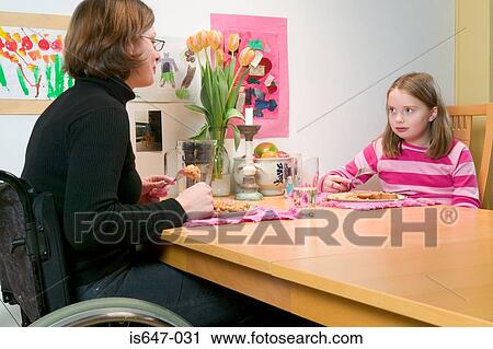 Mother and daughter eating beans on toast View Large Photo Image Stock Image - Mother and daughter eating beans on toast. Fotosearch