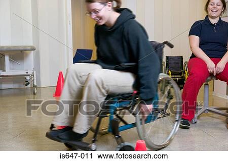 Woman learning to use wheelchair View Large Photo Image Stock Image - Woman learning to use wheelchair. Fotosearch
