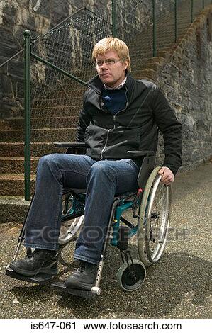 Young man in a wheelchair View Large Photo Image Stock Image - Young man in a wheelchair. Fotosearch