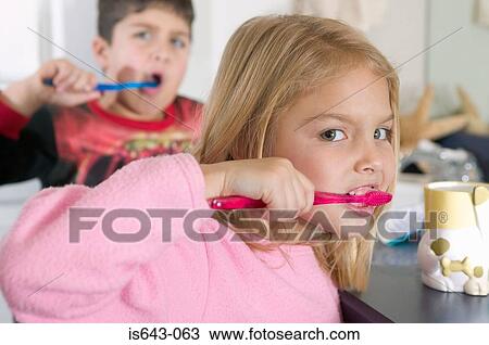 Brother and sister brushing teeth View Large Photo Image Stock Image - Brother and sister brushing teeth. Fotosearch