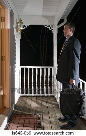 Businessman arriving home View Large Photo Image Stock Photograph - Businessman arriving home. Fotosearch
