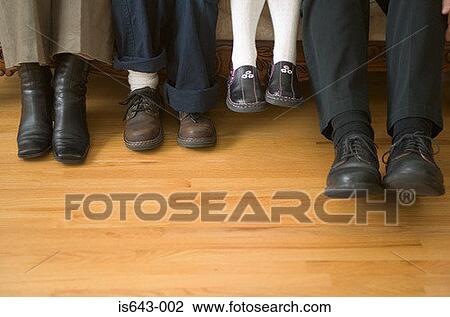 Stock Image - Close-up of family shoes. Fotosearch