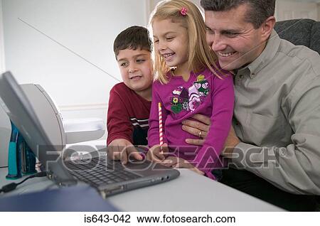 Father and children using computer View Large Photo Image Stock Image - Father and children using computer. Fotosearch
